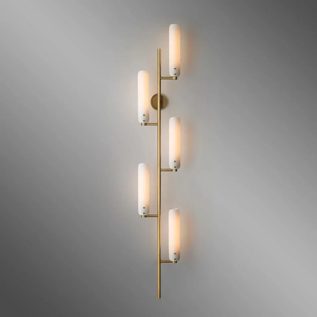 Elegant Copper Sconce Wall Lamp with vertical brass frame and multiple frosted tube lights, casting a warm, modern ambient glow.