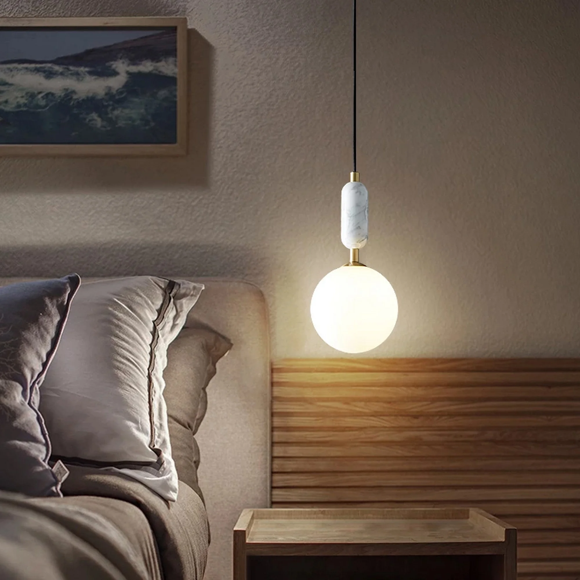 Torrono Pendant Lamp hanging above a bedside table, casting a soft glow in a cozy bedroom.
