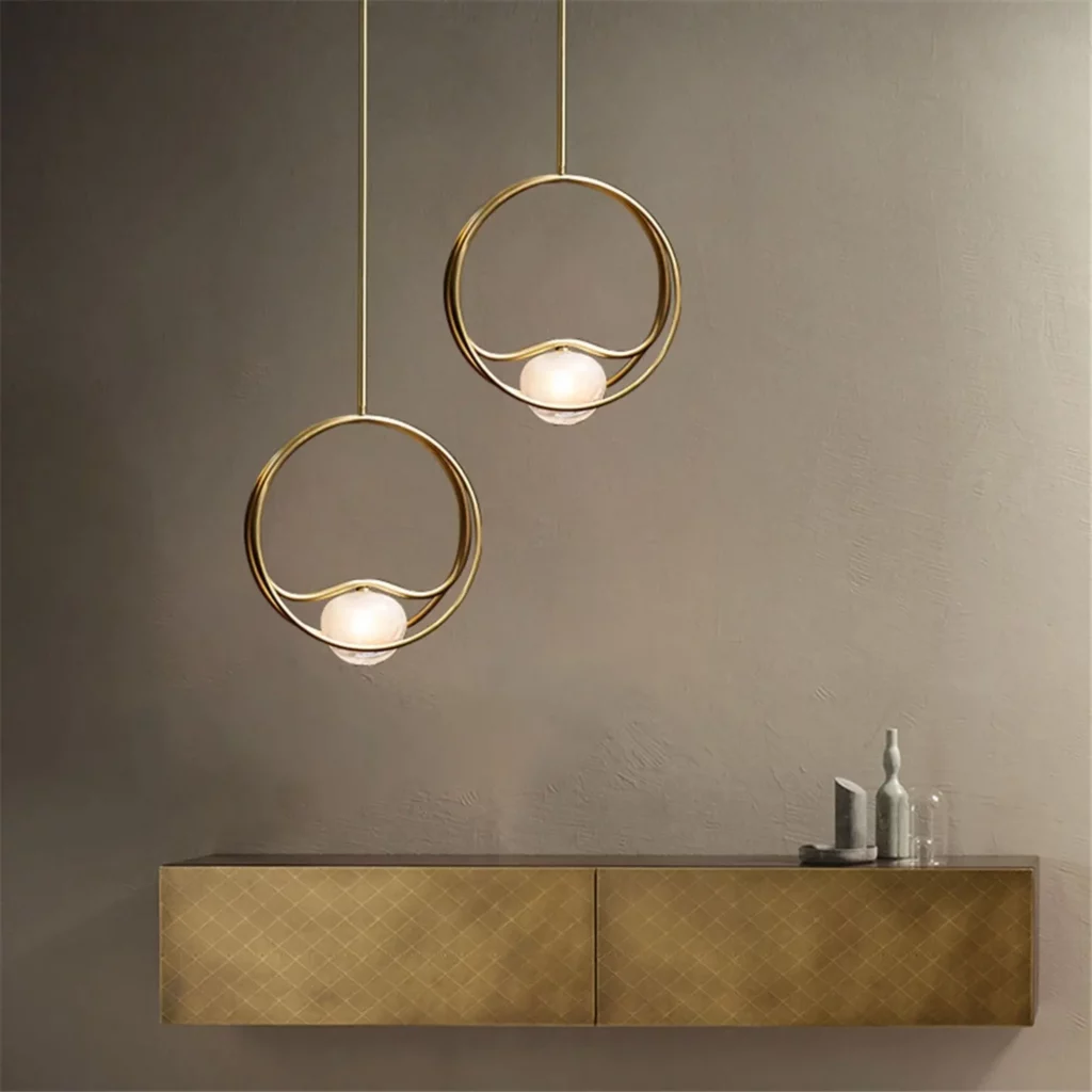 Modern luxury interior featuring Mini Ring & Geometric Pendants with sculptural designs, adding elegant lighting accents to contemporary dining and living spaces