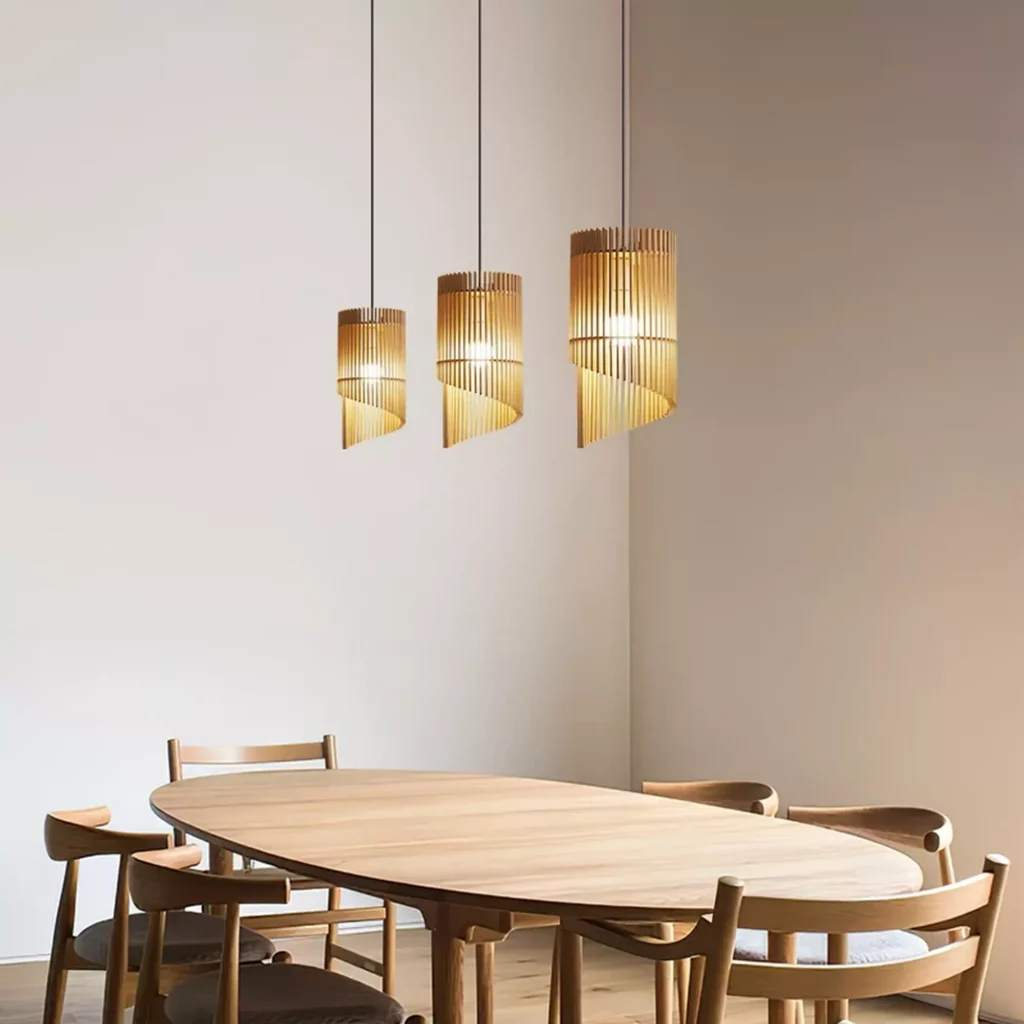 Wood Chime Pendant Light over dining table with three wooden shades, warm ambient glow, minimalist modern interior lighting fixture