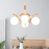 Modern 4 Heads Wooden Chandelier with sleek white and natural wood accents, featuring four round white glass bulbs for a minimalist look.