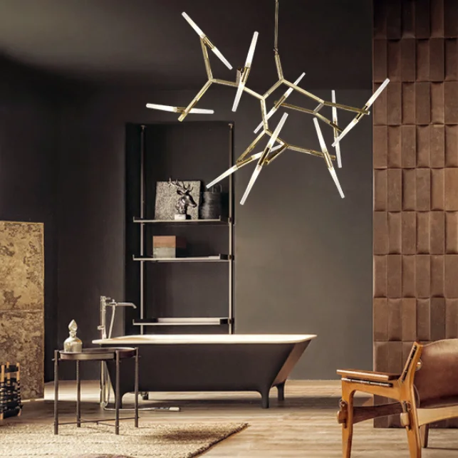 Modern bathroom featuring a freestanding black tub and an Industrial Sputnik Design Chandelier with brass arms and glowing glass spikes.