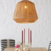Retro Design Hemp Rope Pendant Light hanging above a dining table with candles in a cozy modern interior.