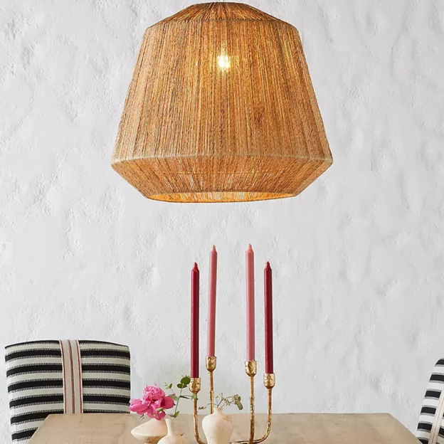 Retro Design Hemp Rope Pendant Light hanging above a dining table with candles in a cozy modern interior.