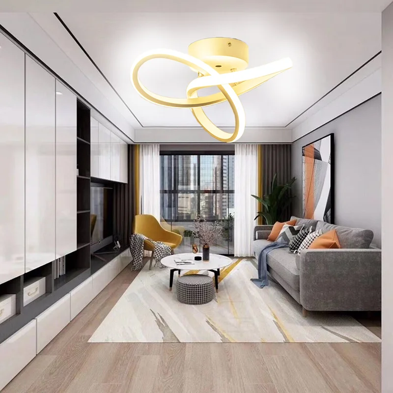 Spiral Design LED Ceiling Light with a gold finish, featuring overlapping glowing loops in a modern, stylish living room.