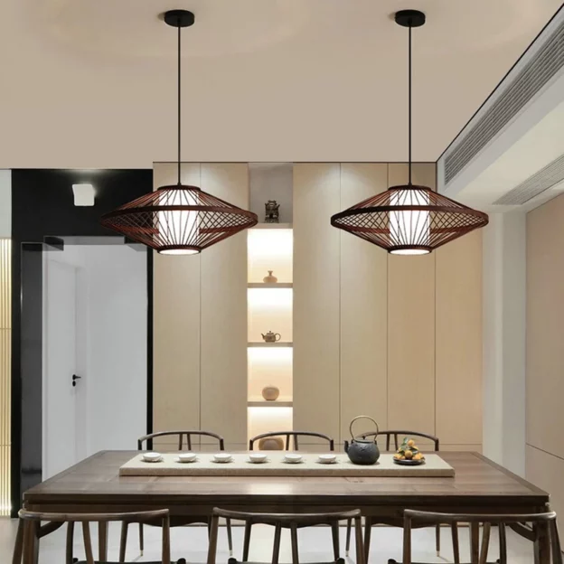 Birdcage Design Pendant Light with rustic cage frame hanging above dining table, adding warm industrial charm to modern interior
