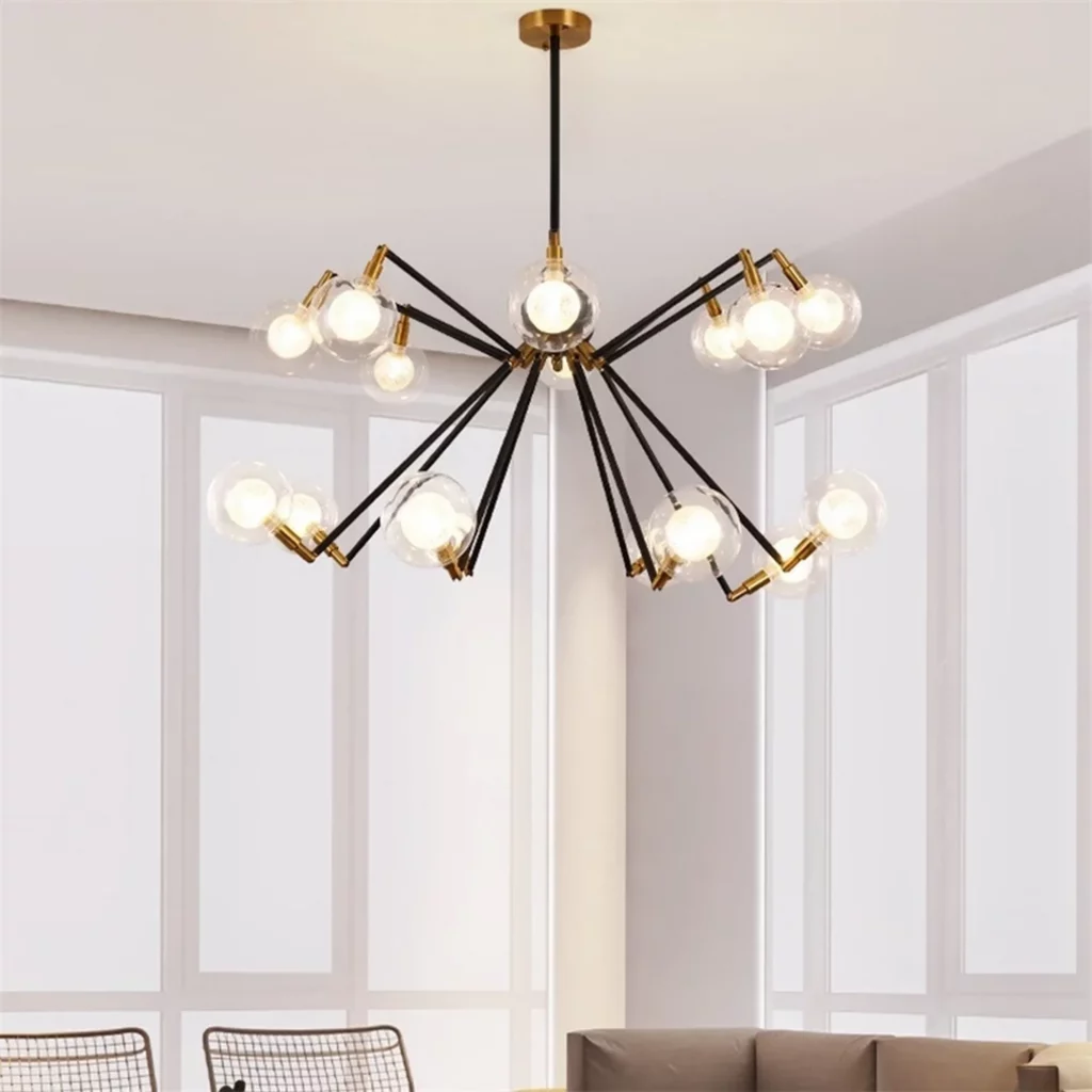 Deluxe Spider Design Arm Chandelier with black and gold arms and glowing glass bulbs in a bright modern living room setting.