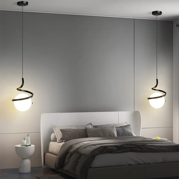 Modern bedroom with two Spiral Design Glass Ball Pendant Light fixtures hanging above upholstered bed and gray bedding