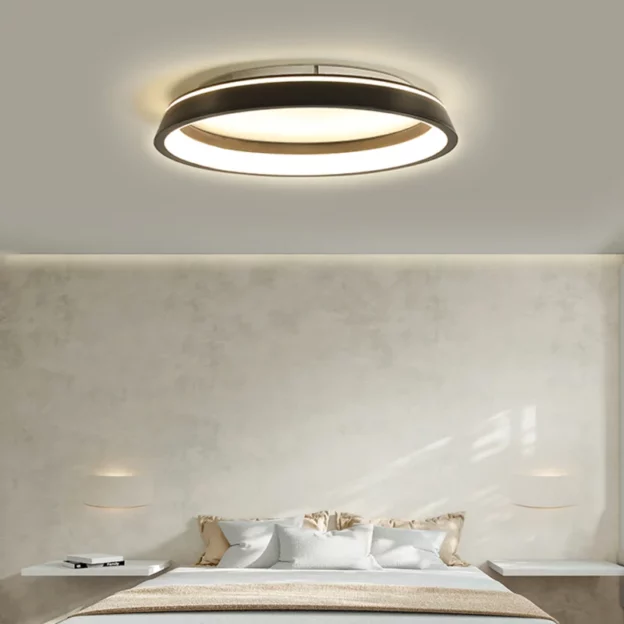 Modern bedroom with Simple Black White LED Ceiling Light, circular flush mount illuminating neutral bed and minimal decor