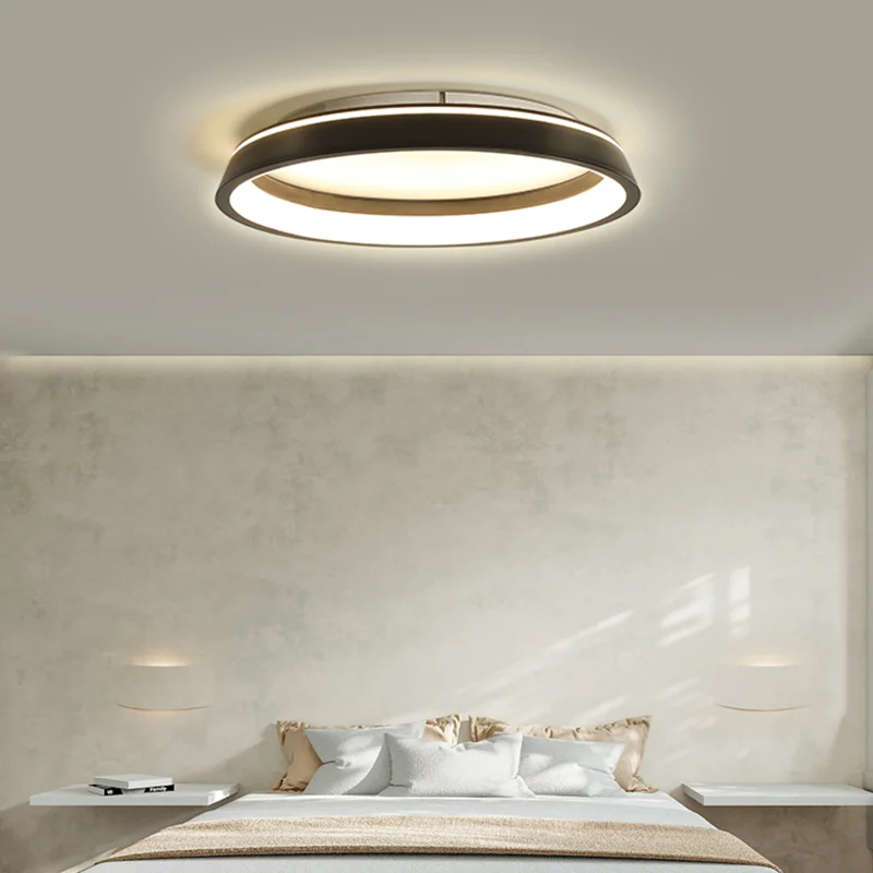Modern bedroom with Simple Black White LED Ceiling Light, circular flush mount illuminating neutral bed and minimal decor