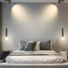 Long Bar with Spotlight LED Pendant Light, casting focused light over a modern bed with a minimalist design in a stylish bedroom.