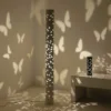 Kady Butterfly Projector Floor & Table Lamp set, casting intricate butterfly-shaped shadows on the walls, creating a dreamy atmosphere.