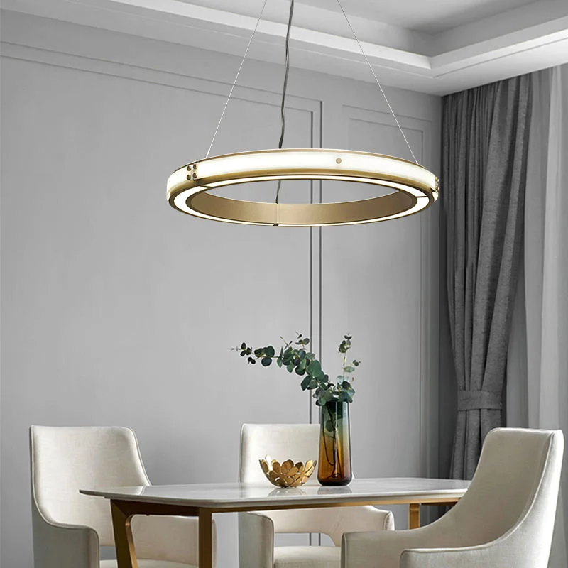 Modern Strata LED Chandelier with Glass ring design, featuring a brushed gold interior and glowing white LED illumination.